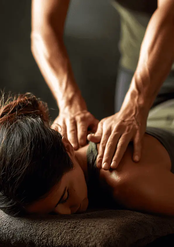 A person receiving a Swedish massage, with a focus on the upper back and shoulders, emphasizing relaxation and wellness.